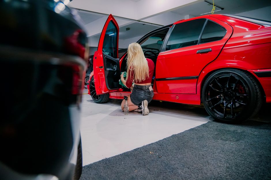Cleaning and vacuuming the interior of a luxury vehicle